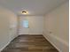 Finished basement room with vinyl flooring, door, and ample storage at 4906 Holbrook Cir, Duluth, GA 30096