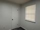 Bedroom with gray carpet, window, and closet at 4906 Holbrook Cir, Duluth, GA 30096