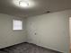 Well-lit bedroom featuring new carpet and neutral walls at 4906 Holbrook Cir, Duluth, GA 30096