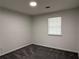 Bedroom with gray carpet and window at 4906 Holbrook Cir, Duluth, GA 30096