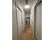 Long hallway with tile flooring and doors at 4906 Holbrook Cir, Duluth, GA 30096