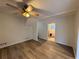 Living room with hardwood floors and access to basement stairs at 4906 Holbrook Cir, Duluth, GA 30096