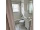 Updated bathroom with white subway tile and marble floor at 524 Jetal Nw Pl, Atlanta, GA 30318