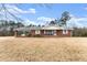 Brick house with covered porch, on large lot at 1131 Harbins Rd, Dacula, GA 30019