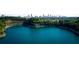 Aerial view of a lake and cityscape. A person is visible kayaking at 2107 Abner Nw Pl, Atlanta, GA 30318