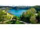 Aerial view of a lake with walking trails and cityscape in the background at 2107 Abner Nw Pl, Atlanta, GA 30318