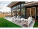 Modern patio furniture on a spacious patio with a grassy lawn at 2107 Abner Nw Pl, Atlanta, GA 30318