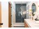 Bathroom with herringbone tile shower and double vanity at 2107 Abner Nw Pl, Atlanta, GA 30318