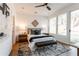 Bright bedroom with a queen-size bed and wood nightstands at 2107 Abner Nw Pl, Atlanta, GA 30318