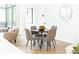 Modern dining area featuring a round table and four gray chairs at 2107 Abner Nw Pl, Atlanta, GA 30318