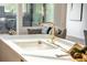 Sleek kitchen sink and gold faucet in a contemporary kitchen at 2107 Abner Nw Pl, Atlanta, GA 30318