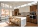 Modern kitchen with an expansive island and access to a patio at 2107 Abner Nw Pl, Atlanta, GA 30318