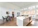 Open floor plan with modern kitchen, dining area, and wall of windows at 2107 Abner Nw Pl, Atlanta, GA 30318