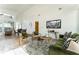 Living room with green velvet sofa and wood accent chairs at 2107 Abner Nw Pl, Atlanta, GA 30318