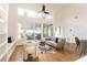 Spacious living area with hardwood floors, built-ins and large windows at 2107 Abner Nw Pl, Atlanta, GA 30318