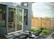 Private patio with modern seating and fenced backyard at 2107 Abner Nw Pl, Atlanta, GA 30318