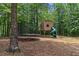 Large backyard with playset and trampoline at 25 Highlands Way, Oxford, GA 30054