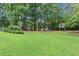 Landscaped backyard with shed and play area at 25 Highlands Way, Oxford, GA 30054