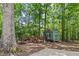 Storage shed and wood pile at 25 Highlands Way, Oxford, GA 30054