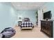 Finished basement bedroom with built-in shelving at 25 Highlands Way, Oxford, GA 30054