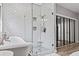 Modern bathroom with white subway tile shower and soaking tub at 25 Highlands Way, Oxford, GA 30054