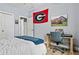 Cozy bedroom with a desk, featuring a gray and blue color scheme at 25 Highlands Way, Oxford, GA 30054