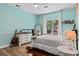 Light teal bedroom with a cowhide rug and wood floors at 25 Highlands Way, Oxford, GA 30054