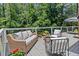 Relaxing deck with wicker furniture and views at 25 Highlands Way, Oxford, GA 30054