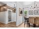 Dining area with shiplap wall and view into kitchen area at 25 Highlands Way, Oxford, GA 30054