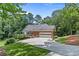 Brick house with attached garage and driveway at 25 Highlands Way, Oxford, GA 30054