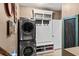 Laundry room with stacked washer and dryer at 25 Highlands Way, Oxford, GA 30054