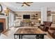 Spacious living room featuring a fireplace, built-in shelving, and comfortable seating at 25 Highlands Way, Oxford, GA 30054