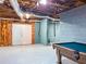 Unfinished basement with a pool table and plenty of storage space at 4969 Donald Dr, Loganville, GA 30052