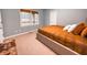 Bedroom with large bed and view of backyard at 4969 Donald Dr, Loganville, GA 30052