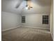 Spacious bedroom with carpeted floors and ceiling fan at 5863 Seabright Ln, Atlanta, GA 30349