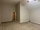Large bedroom with plush carpet and access to a hallway at 5863 Seabright Ln, Atlanta, GA 30349
