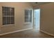 Spacious bedroom featuring two windows and access to another room at 5863 Seabright Ln, Atlanta, GA 30349