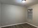 Simple bedroom with light gray walls and vinyl flooring at 5863 Seabright Ln, Atlanta, GA 30349