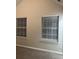Bright bedroom with two windows and neutral walls at 5863 Seabright Ln, Atlanta, GA 30349