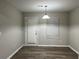 Simple dining room with light gray walls and vinyl flooring at 5863 Seabright Ln, Atlanta, GA 30349