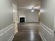 Bright hallway with hardwood floors leading to living room and fireplace at 5863 Seabright Ln, Atlanta, GA 30349