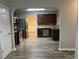 View of kitchen with stainless steel appliances and dark wood cabinets at 5863 Seabright Ln, Atlanta, GA 30349
