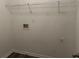 Bright laundry room with shelving and hookups at 5863 Seabright Ln, Atlanta, GA 30349