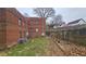 Private backyard with grass, fence, and AC units at 692 Argonne Ne Ave # 2, Atlanta, GA 30308