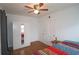 Bedroom with hardwood floors, mirrored wardrobe, and ceiling fan at 692 Argonne Ne Ave # 2, Atlanta, GA 30308