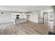 Bright, open layout with white cabinets, hardwood floors, and island, creating a modern and inviting space for cooking and entertaining at 14 Cambridge Ln, Dallas, GA 30157