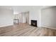Spacious living room featuring a modern fireplace, hardwood floors, and an open layout, perfect for entertaining and relaxation at 14 Cambridge Ln, Dallas, GA 30157