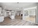 Bright living space featuring an open floor plan, a modern kitchen, a fireplace, and a walk-out patio at 14 Cambridge Ln, Dallas, GA 30157
