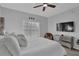 Bright bedroom featuring a large bed, TV, and a mirrored dresser at 2700 Pine Tree Ne Rd # 2306, Atlanta, GA 30324