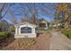 Carrington Park Condominiums entrance with sign and landscaping at 2700 Pine Tree Ne Rd # 2306, Atlanta, GA 30324